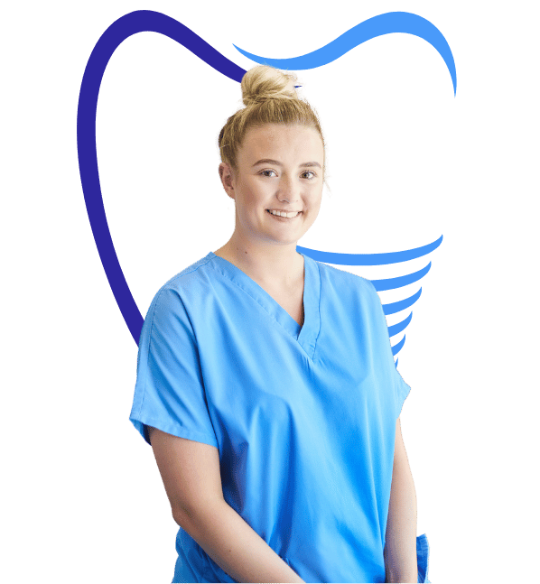 A Dental Implant Doctor in blue scrubs standing in front of a white background.